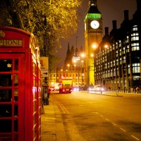 Phone booths and Big Ben at night